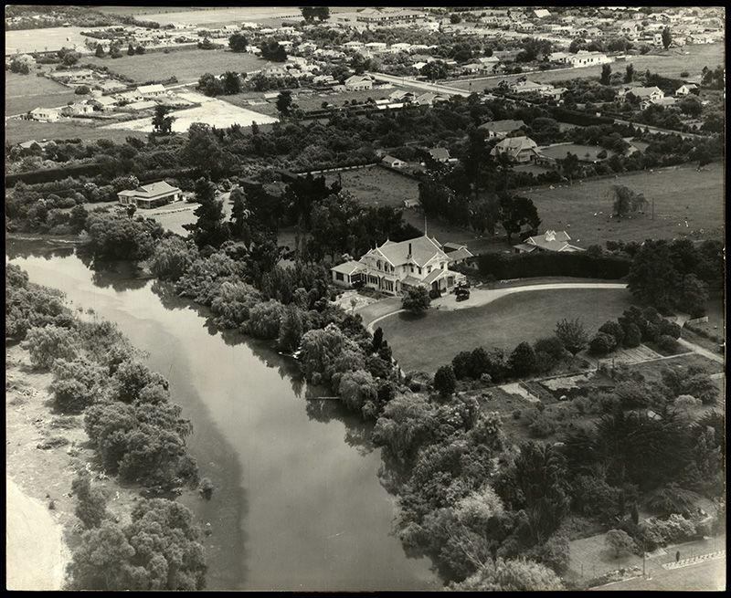 a black and white picture shows the ariel view of a building by water