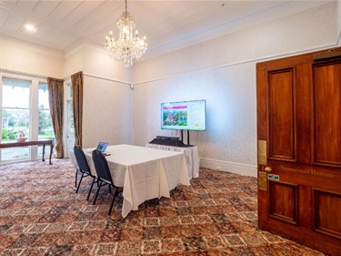 image shows the meeting set up in a room